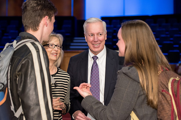 Elder Kevin S. Hamilton, and Sister Hamilton talk to students after the devotional.