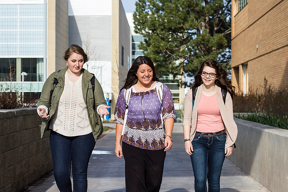 Students talk outside the library on the first day of classes during the 2014 Spring Semester.