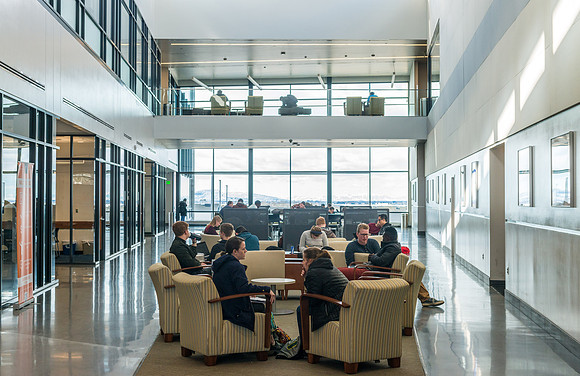 Students studying in the lobby of the Science and Technology Center.