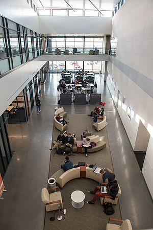 Students studying in the lobby of the Science and Technology Center.
