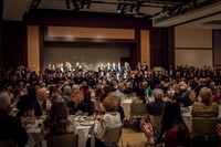 A choir performs a special musical number at the banquet.