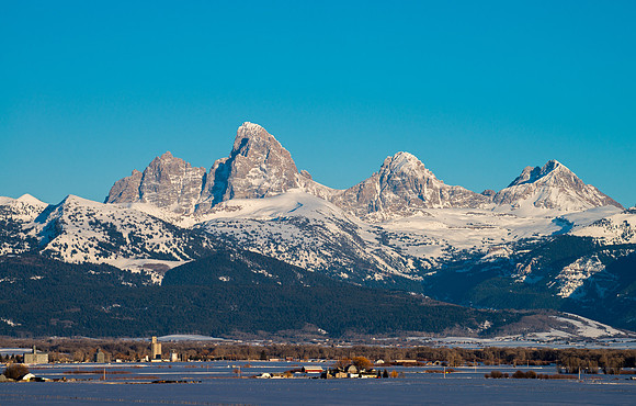 The Grand Teton Mountains loom above the Teton Valley in Eastern Idaho.