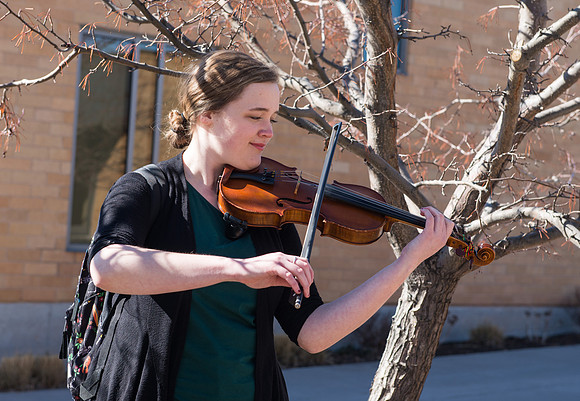 Fiddler, practicing outside the Snow Building on a beautiful sunny day.