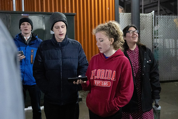 BYU-Idaho students participate in singing hymns under the stadium.