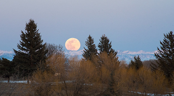 The third Supermoon of the year rising over the mountain tops. March 2019