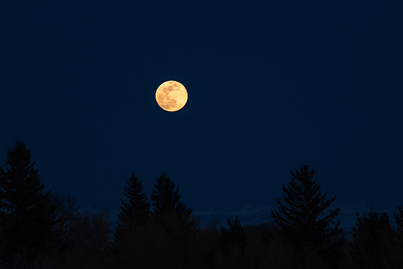 The third Supermoon of the year rising over the mountain tops. March 2019