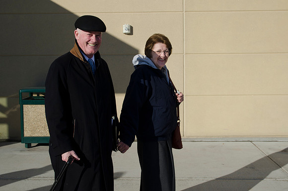 President and Sister Clark leave devotional together.