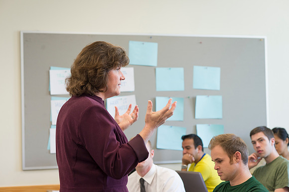 Sister Brooke McKenna teaches students in a communication class.