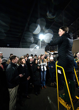 Students gather under the BYU-I Stadium to sing hymns.