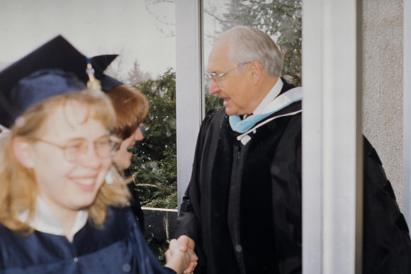 Elder Perry greeting students