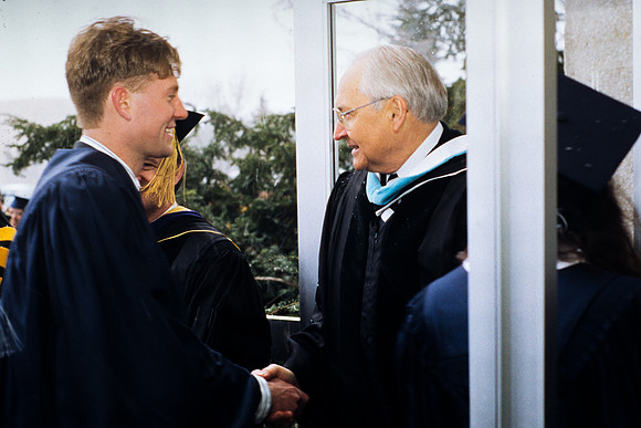 Elder Perry greeting students