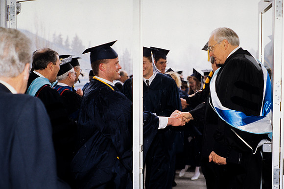 Elder Perry greeting students