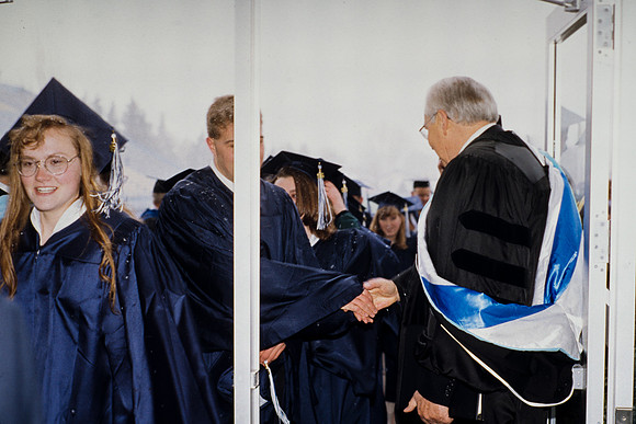 Elder Perry greeting students