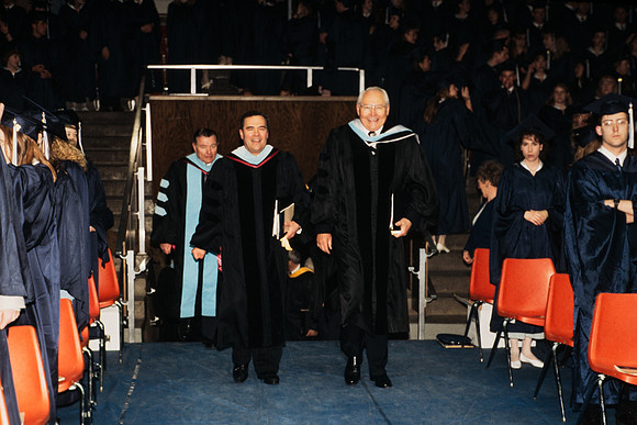 Elder Perry and President Bennion entering auditorium
