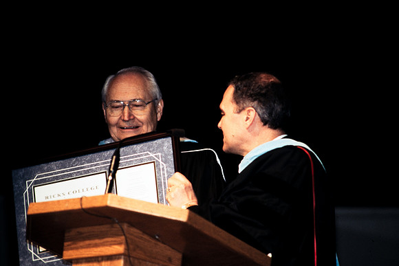 Elder Perry recieving honorary degree from president Bennion.