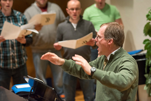 Randall Kempton instructs the talented students who make up the Collegiate Singers at BYU-Idaho.