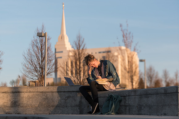 Marisa Bone takes time to study, plan, and prepare with a view of the Rexburg Idaho Temple in the background.