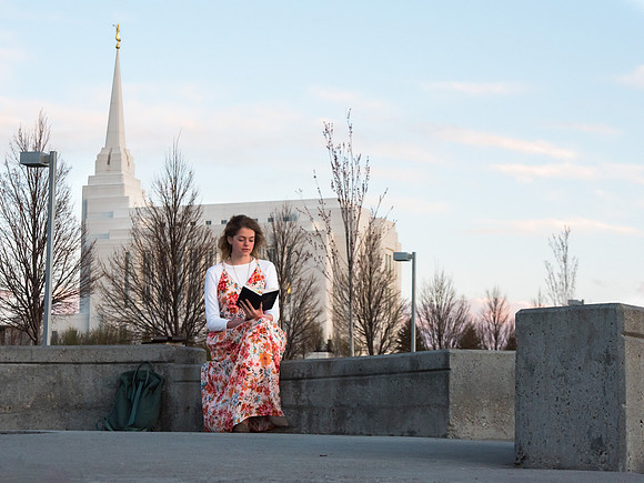 Marisa Bone takes time to study, plan, and prepare with a view of the Rexburg Idaho Temple in the background.