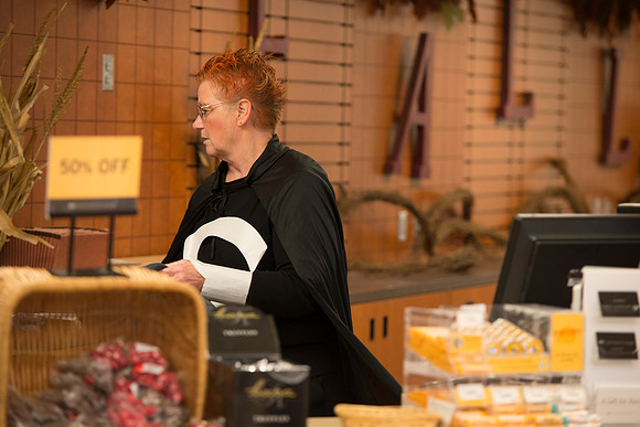 Employees of the University Store on campus stop for a photo in their Halloween costumes.