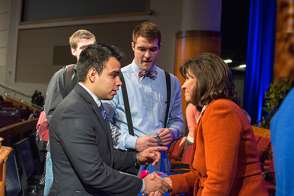 Carole Stephens meets with Brigham Young university-Idaho students and shakes hands with them. Photo by Ryan Chase