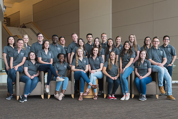 Group photos in the BYU-Idaho Center for the various student support teams.