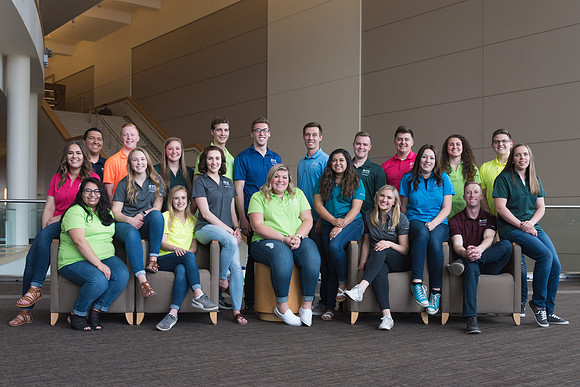Group photos in the BYU-Idaho Center for the various student support teams.