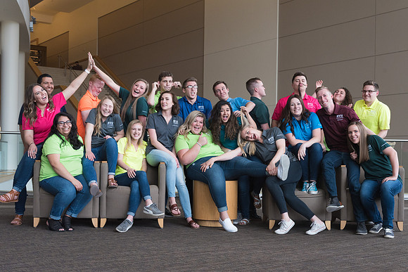 Group photos in the BYU-Idaho Center for the various student support teams.