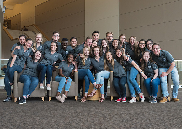 Group photos in the BYU-Idaho Center for the various student support teams.