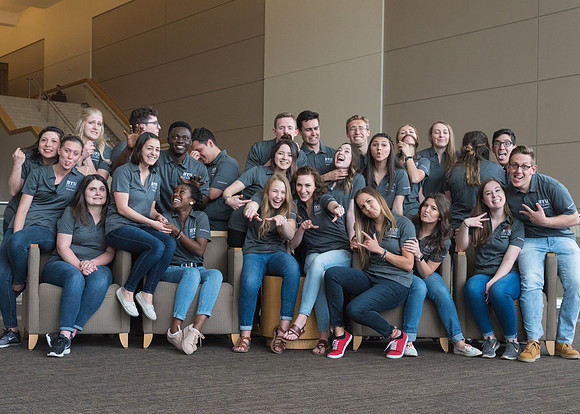 Group photos in the BYU-Idaho Center for the various student support teams.