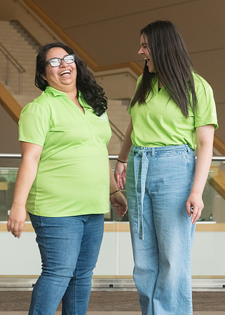 Group photos in the BYU-Idaho Center for the various student support teams.