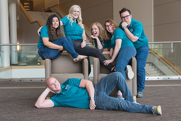 Group photos in the BYU-Idaho Center for the various student support teams.