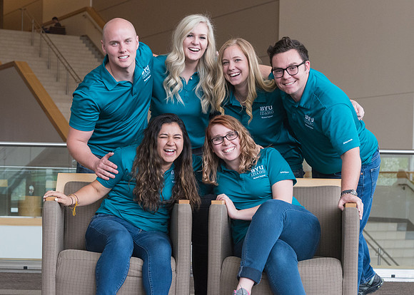 Group photos in the BYU-Idaho Center for the various student support teams.