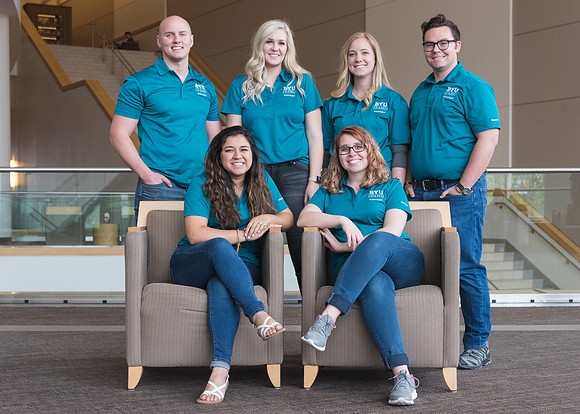 Group photos in the BYU-Idaho Center for the various student support teams.