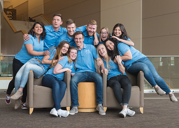 Group photos in the BYU-Idaho Center for the various student support teams.