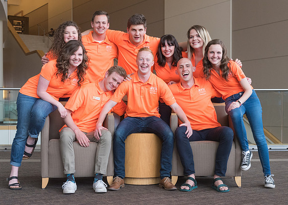 Group photos in the BYU-Idaho Center for the various student support teams.