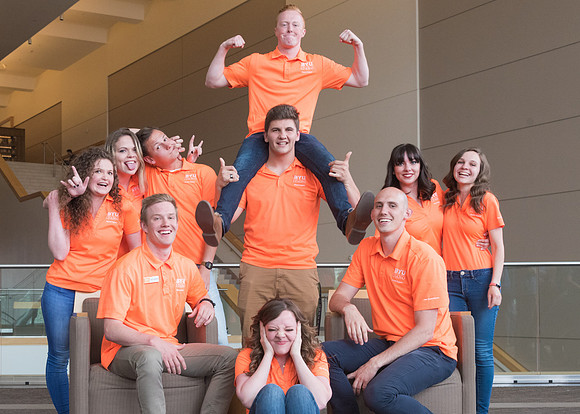 Group photos in the BYU-Idaho Center for the various student support teams.
