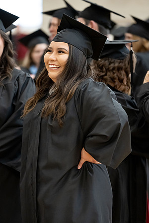 BYU-Idaho graduates gather in the I-Center to hear from Elder Carlos A. Godoy of the Seventy as he speaks at commencement.