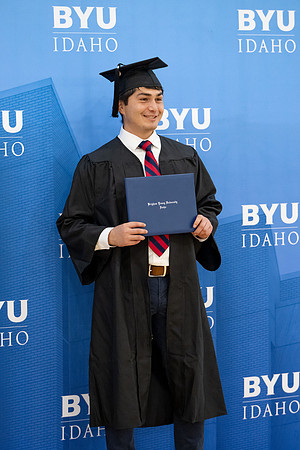 BYU-Idaho graduates gather in the I-Center to hear from Elder Carlos A. Godoy of the Seventy as he speaks at commencement.