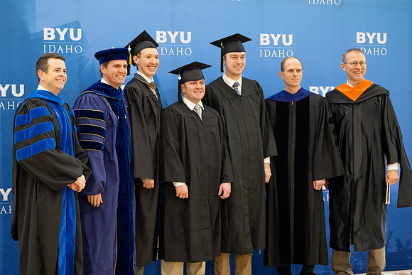 BYU-Idaho graduates gather in the I-Center to hear from Elder Carlos A. Godoy of the Seventy as he speaks at commencement.