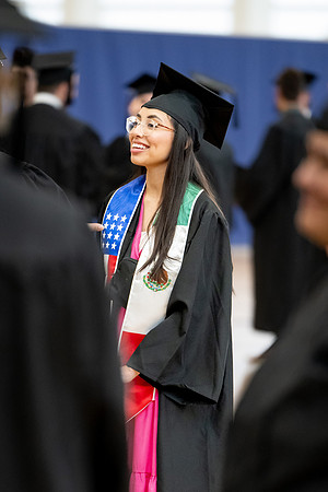 BYU-Idaho graduates gather in the I-Center to hear from Elder Carlos A. Godoy of the Seventy as he speaks at commencement.