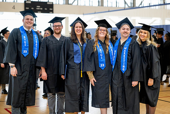 BYU-Idaho graduates gather in the I-Center to hear from Elder Carlos A. Godoy of the Seventy as he speaks at commencement.