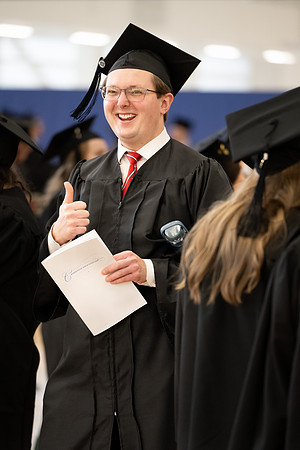 BYU-Idaho graduates gather in the I-Center to hear from Elder Carlos A. Godoy of the Seventy as he speaks at commencement.