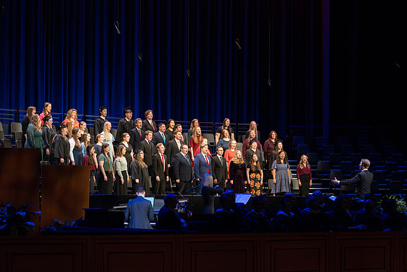 BYU-Idaho graduates gather in the I-Center to hear from Elder Carlos A. Godoy of the Seventy as he speaks at commencement.