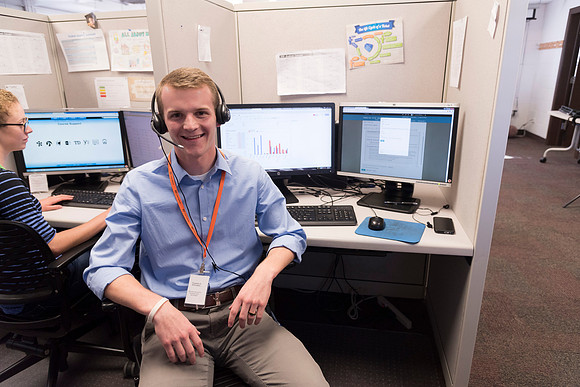 Employees work on developing a better curriculum for online students.
