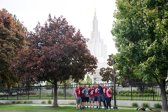 After braving the unpredictable Idaho weather in June, teams celebrate crossing the finish line near the Idaho Falls Temple in the annual temple to temple relay race.