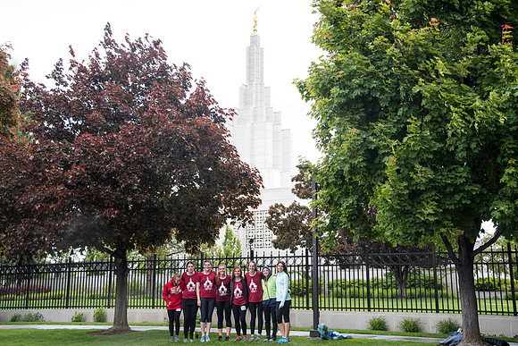 After braving the unpredictable Idaho weather in June, teams celebrate crossing the finish line near the Idaho Falls Temple in the annual temple to temple relay race.