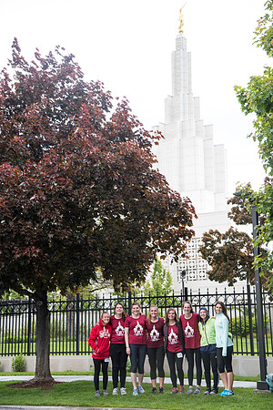 After braving the unpredictable Idaho weather in June, teams celebrate crossing the finish line near the Idaho Falls Temple in the annual temple to temple relay race.