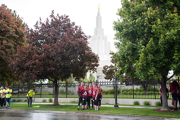 After braving the unpredictable Idaho weather in June, teams celebrate crossing the finish line near the Idaho Falls Temple in the annual temple to temple relay race.