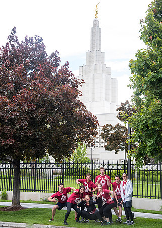 After braving the unpredictable Idaho weather in June, teams celebrate crossing the finish line near the Idaho Falls Temple in the annual temple to temple relay race.