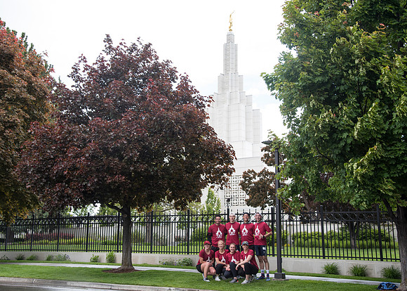 After braving the unpredictable Idaho weather in June, teams celebrate crossing the finish line near the Idaho Falls Temple in the annual temple to temple relay race.